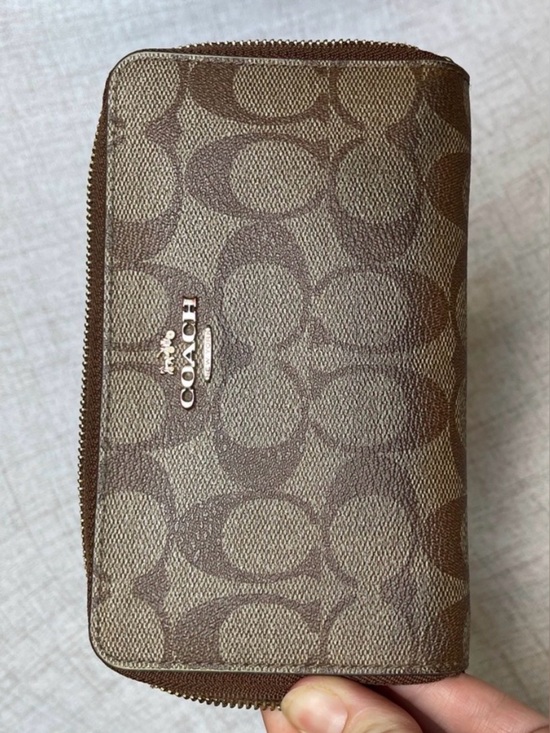 Coach Handbags - Coach Brown Signature Canvas Zip Wallet with Logo Plaque